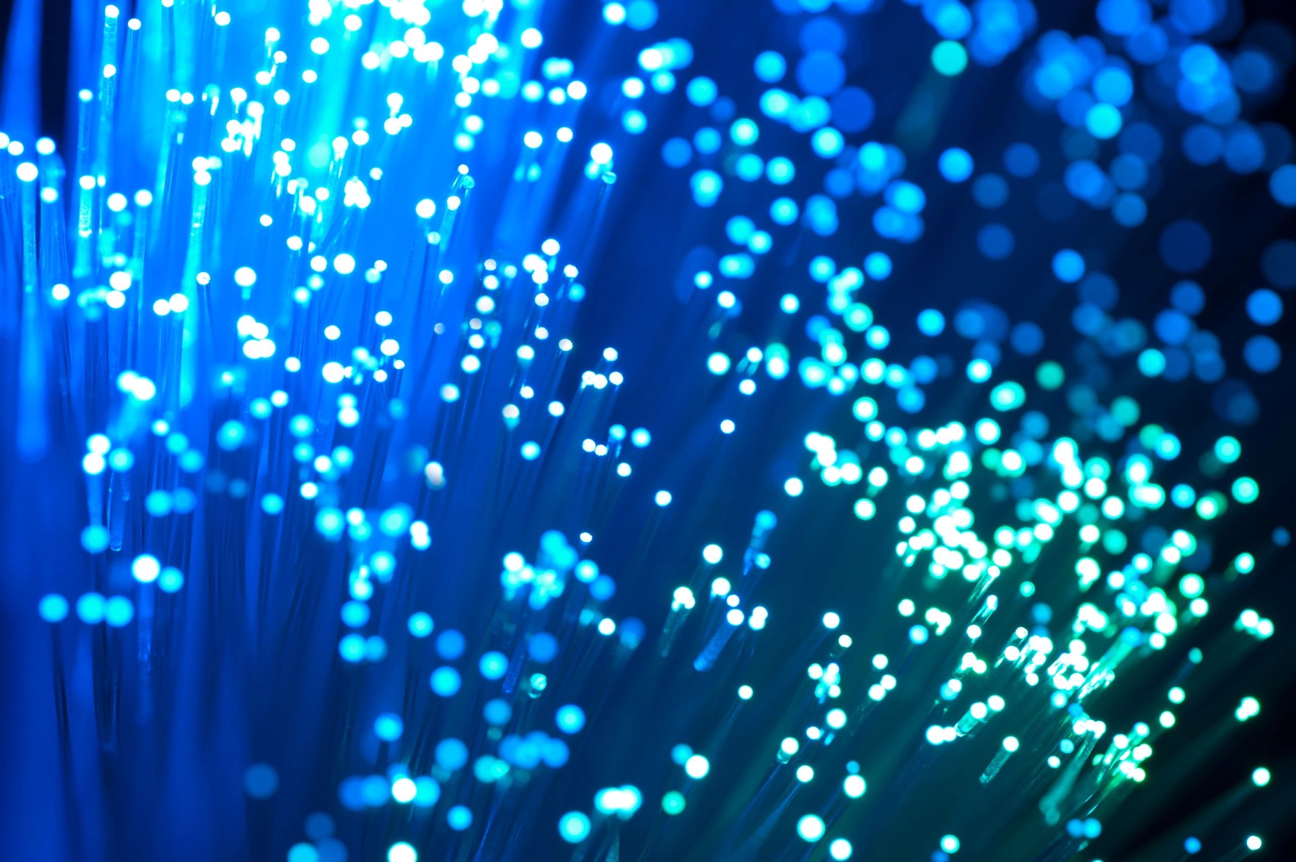Blue fiber optic strands on dark background